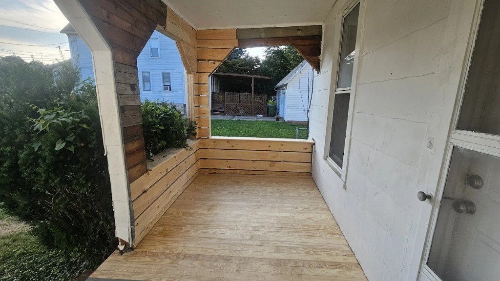 Custom wood porch and deck remodel with new decking and trim