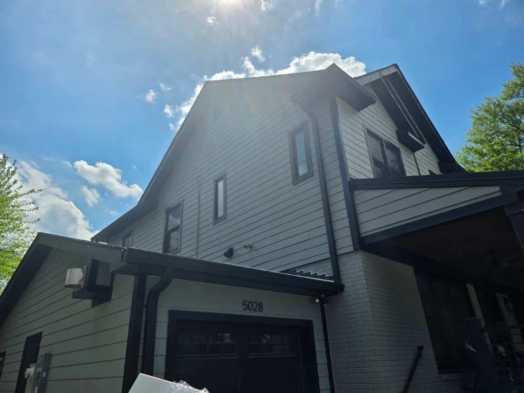 Full James Hardie fiber-cement siding replacement on a two-story home
